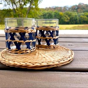 Two glasses with rattan embellishment.